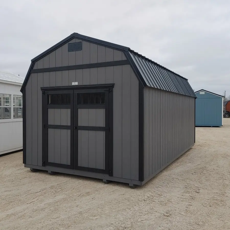 Charcoal grey lofted barn with black trim and a black metal roof